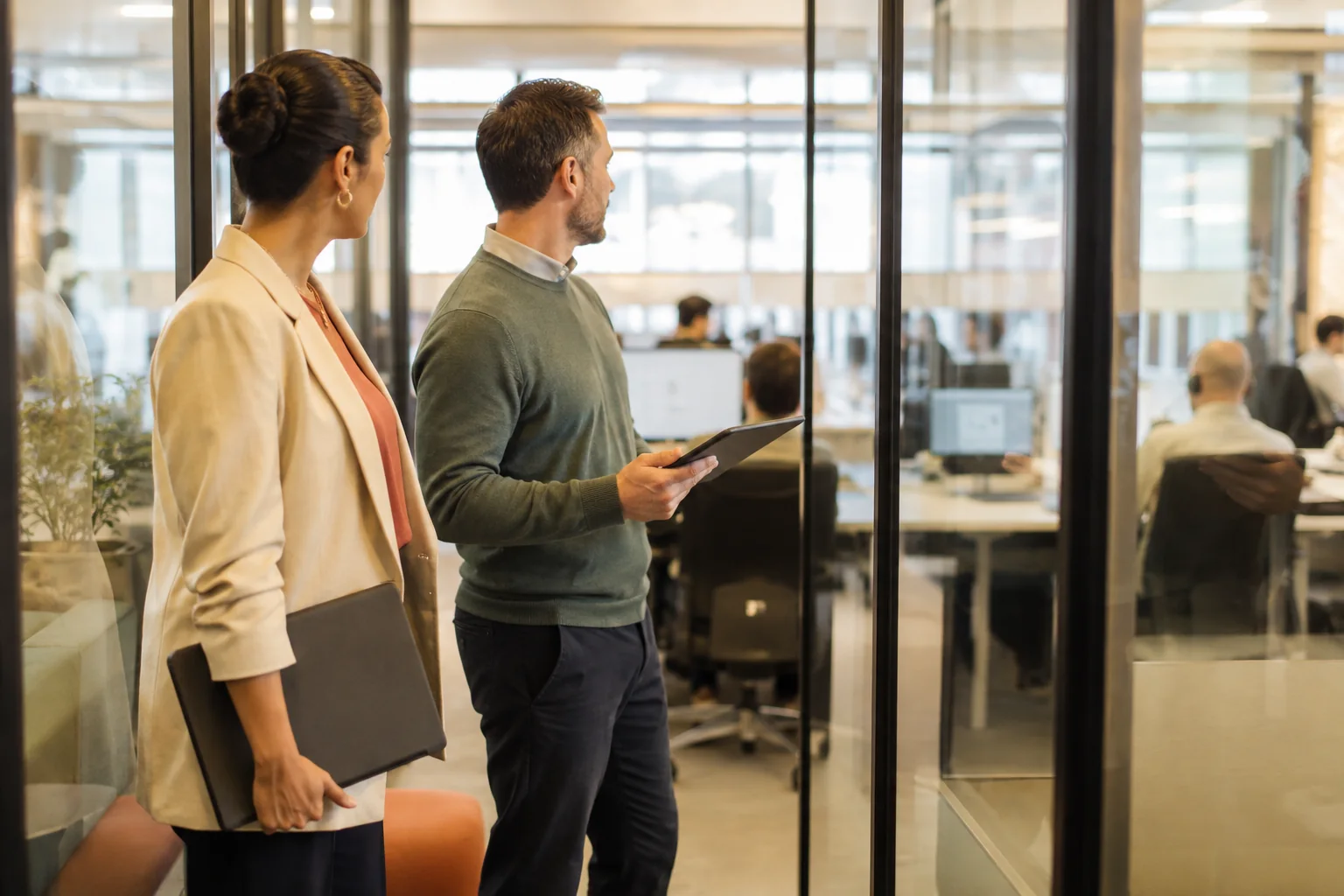 Two people discussing customer-service decisions, ownership and process design.